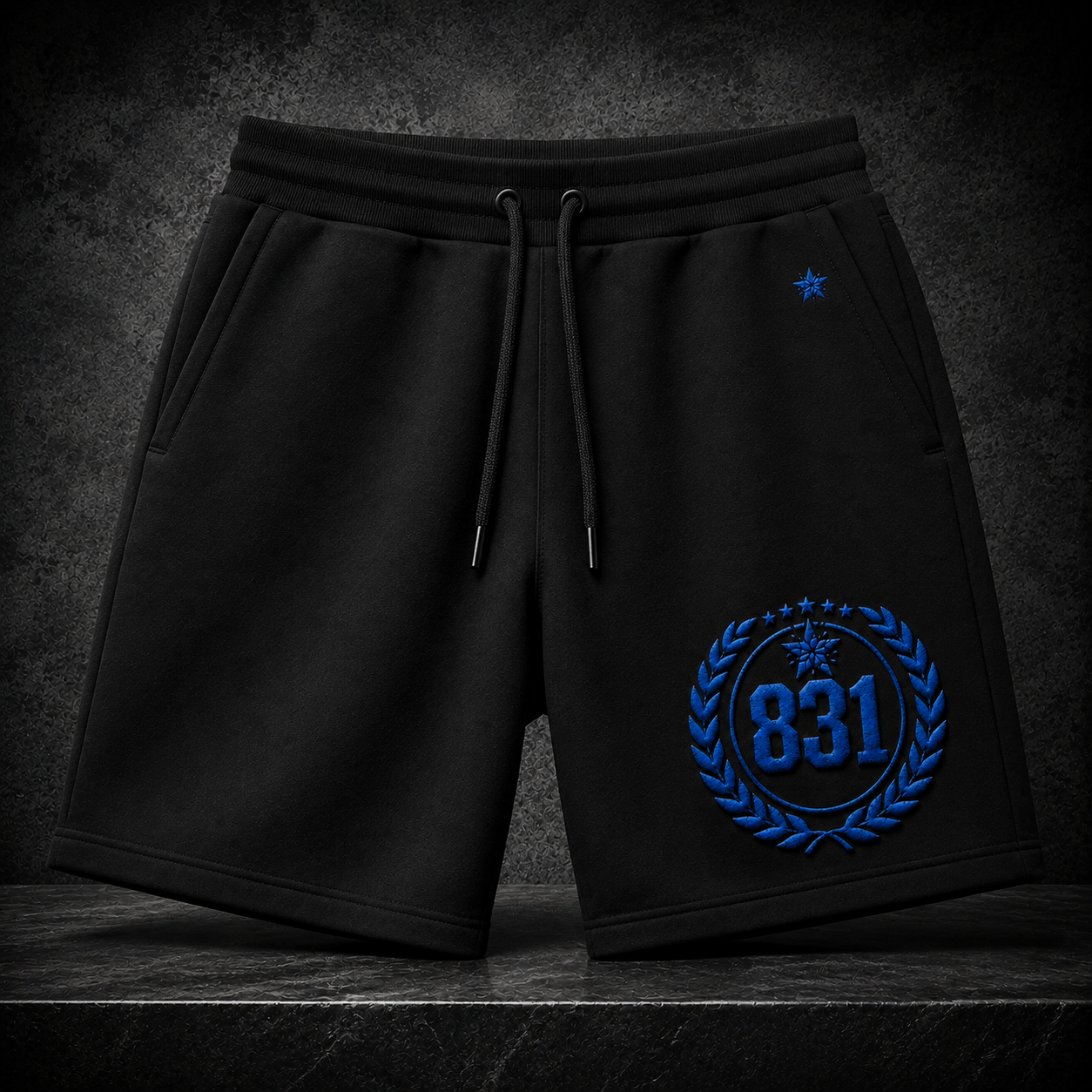 831 Shorts — black shorts with blue 831 laurel emblem